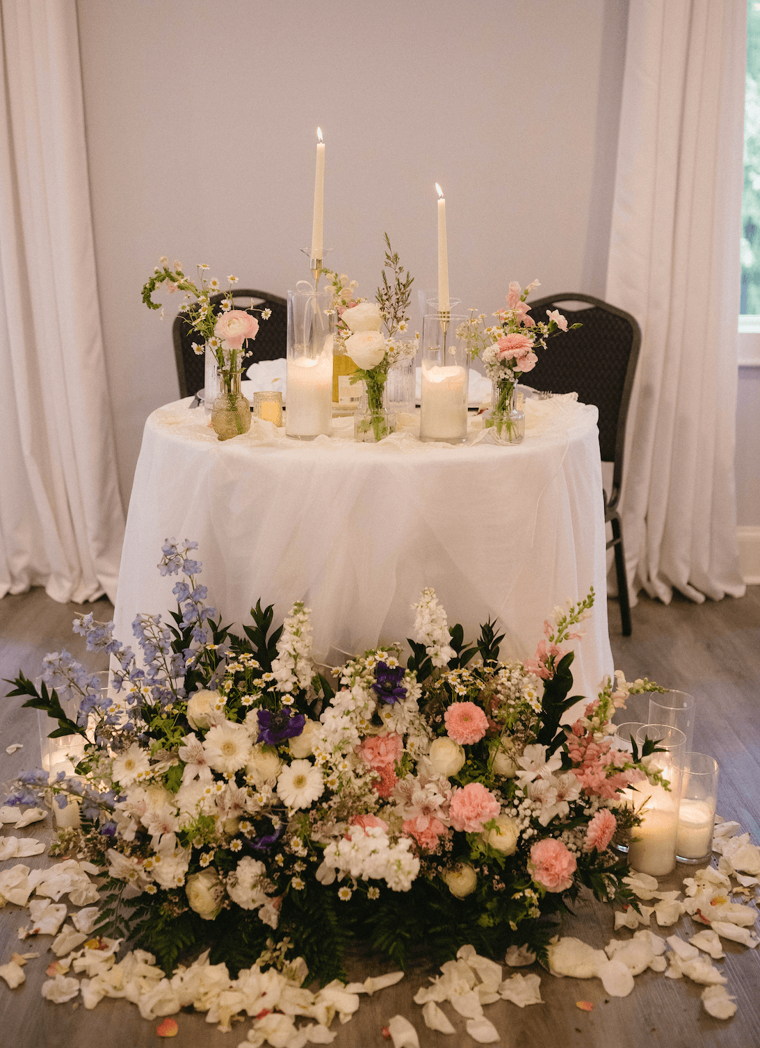 Sweetheart table with lush floral arrangement